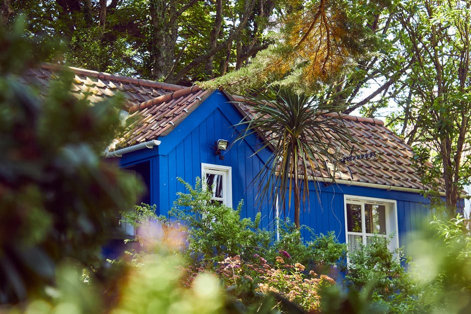 home with blue paint and tile roof
