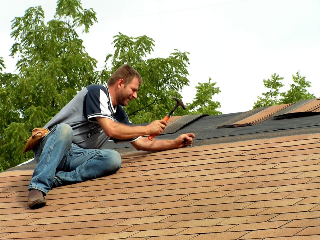 Person Fixing Roof